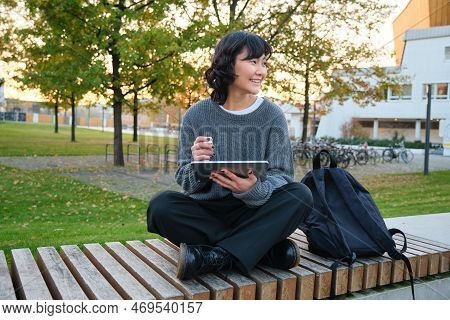 Young Asian Girl, Student Sits On Bench, Graphic Designer With Pencil And Digital Tablet Draws Scatc