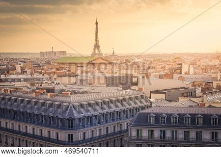 Paris Skyline At Sunset With Eiffel Tower Above Parisien Roofs, Paris, France