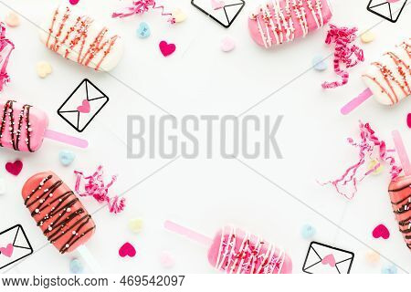 A Valentines Day Border Frame Including Cakesicles And Decorations.