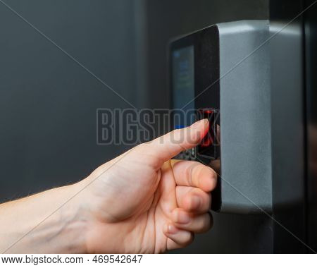 A Woman Opens The Door With Her Fingerprint. Modern Keyless Entry Lock.