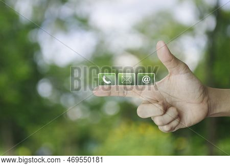 Telephone, Mail, Email Address Icon On Finger Over Blur Green Tree In Park, Business Customer Servic