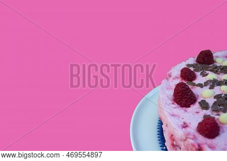 Rasperry Cake With Cream And White Chocolate On Wooden Board