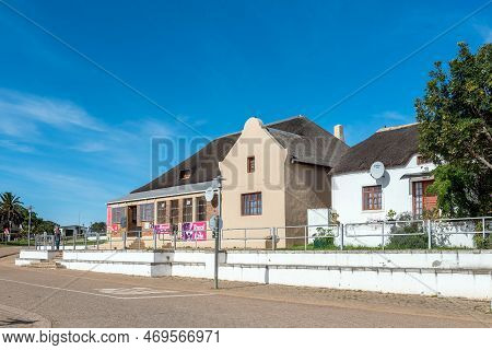 Elim, South Africa - Sep 21, 2022: A Street Scene, With The Royal Cafe And An  Historic House, In El