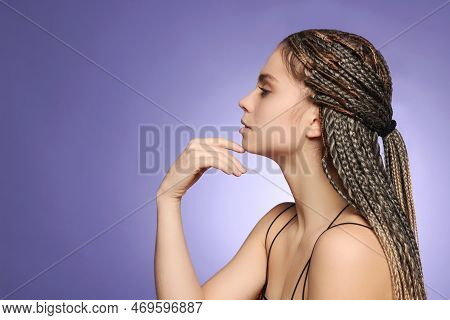 Beautiful Woman With Long African Braids On Purple Background, Space For Text