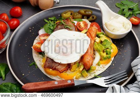 Kebab With Bacon And Fried Egg, Tomato, Spinach, Avocado, Pickled Peppers