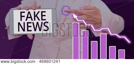 Hand Writing Sign Fake News. Business Overview Giving Information To People That Is Not True By The 