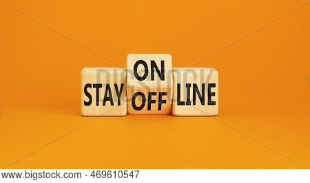 Stay Online Or Offline Symbol. Concept Word Stay Online Or Offline On Wooden Cubes. Beautiful Orange