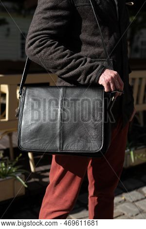 Close-up Photo Of Black Messanger Leather Bag On Mans Shoulder
