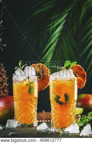 Alcoholic Cocktail With Vodka, Pineapple Juice, Mango, Liquor, Ice. Long Drink Or Summer Cold Mockta