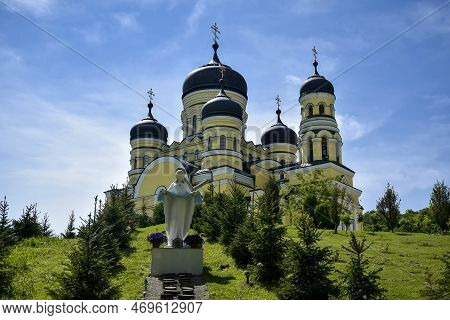 View Of Orthodox Cathedral With Domes In Monastery Against Background Of Green Landscape And Cloudy 