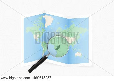 Enlarge Congo With A Magnifying Glass On A Folded Map Of The World. Vector Paper Map.