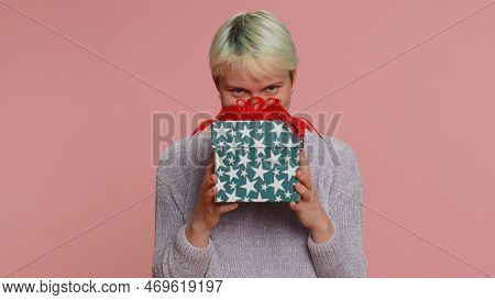 Positive Smiling Woman Presenting Birthday Gift Box Stretches Out Hands, Offer Wrapped Present Caree