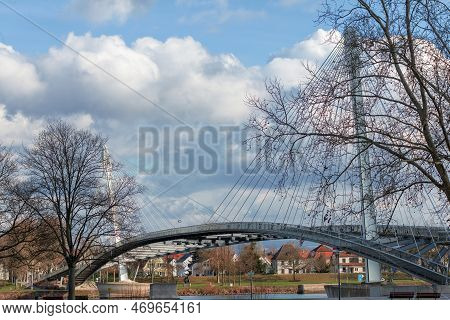 Pedestrian Suspension Bridge Over The Rhine At Day