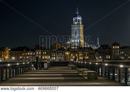 The City Deventer In The Netherlands By Night With The Lebuinus Church