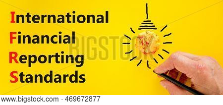 Ifrs Symbol. Concept Words Ifrs International Financial Reporting Standards On Yellow Paper Beautifu