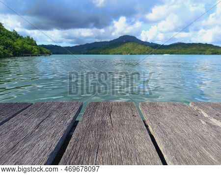 Panoramic View Of The Caribbean Sea With Tropical Vegetation And Close-up Of Wooden Pontoon Sheets. 