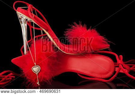 Sexy, Red Strappy High Heel Shoes With Box On A Black Background