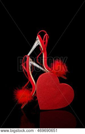 Sexy, Red Strappy High Heel Shoes With Box On A Black Background