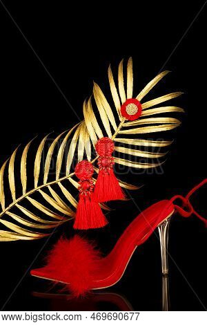 Sexy, Red Strappy High Heel Shoes With Box On A Black Background