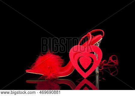 Sexy, Red Strappy High Heel Shoes With Box On A Black Background