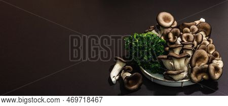 Delicious Organic Oyster Mushrooms With Fresh Parsley. Source Of Beta Glucan, Black Stone Background