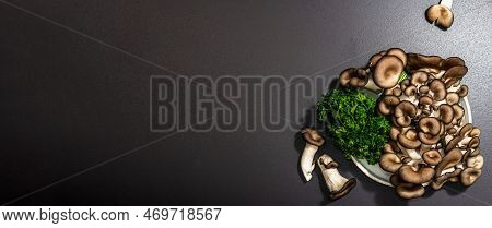 Delicious Organic Oyster Mushrooms With Fresh Parsley. Source Of Beta Glucan, Black Stone Background