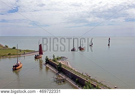 Aerial From Traditional Dutch Wooden Boats At The Ijsselmeer Near The Harbor From Laaxum In Frieslan