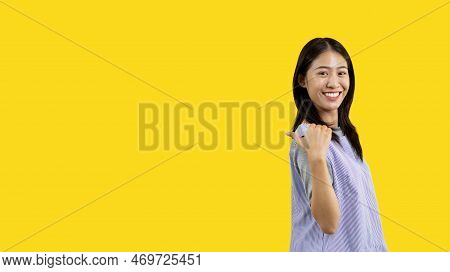 Asian Woman Pointing Finger Inviting Click Here, It Is Recommended To Follow This Direction Or Click