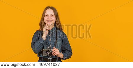 Happy Child With Photo Camera. Child Photographer Yellow Background, Copy Space