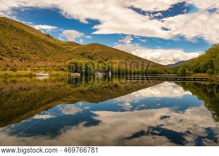 The Crystal Clear Reflections On The Beautiful Serene Little Boat Harbour At Sailors Cutting , Lake 