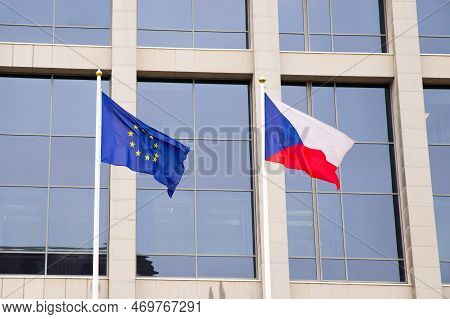 Eu Flag And Czech Republic Flag On Flagpole On Modern Consulate Building. Flag Of European Union And