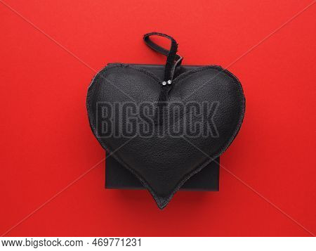 Black Leather Heart On A Black Gift Box On Red Background, Valentines Or Birthday, Lovebackground