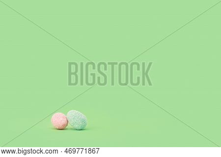 Happy Easter Minimal Concept. Many Tiny Eggs Sweets On Spring Bright Green Edgeless Background. East