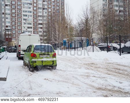 Moscow. Russia. December 17, 2022. An Old Shabby Scratched Green Daewoo Matiz Car In A Snowy Courtya