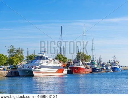 Nesebr, Bulgaria - May 1, 2016: Fishing Boats In The Bay Against The Background Of The Old Town Of N