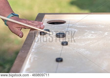 Men Playing Novuss Game. Novuss Is A National Sport In Latvia Similar To Pocket Billiards Or Pool.