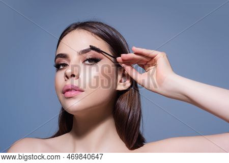Eyebrow Shaping, Woman Combs Eyebrows With A Brus. Eyebrow Line. Makeup And Cosmetology Concept. Fem