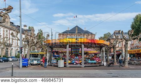 Strasbourg, France - Oct 28, 2022: Merry-go-round Carousel For Kids In Central Place Broglie In Stra