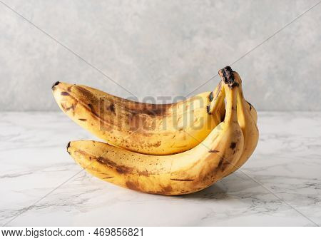 Ripe Overripe Organic Bananas On Concrete Background. Ugly Food Zero Waste Concept
