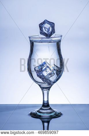 The Image Of Pouring Drinking Water, Into A Broken Glass, That Makes One Feel Refreshed On Blurred W