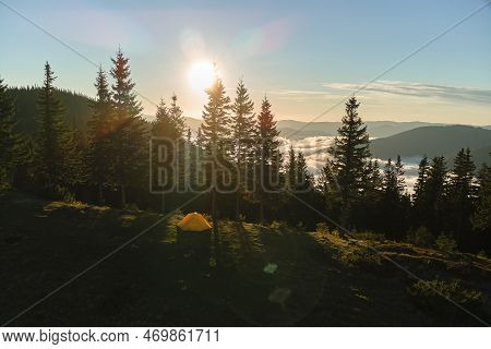 Aerial View Of Tourist Camping Tent On Mountain Campsite At Bright Sunny Evening. Active Tourism And