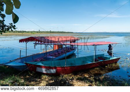 Boats Serving Tourists.the Water,the Swamp,fog,the Mountain,the Beautiful Sky And Cloud At Bueng Kho