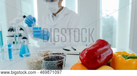 Scientist Check Chemical Food Residues In Laboratory. Control Experts Inspect Quality Of Fruits, Veg