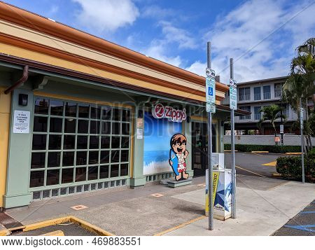Honolulu, Hawaii - January 23, 2021: Zippy's Sign And Entrance To Building And Parking Lot With Hand
