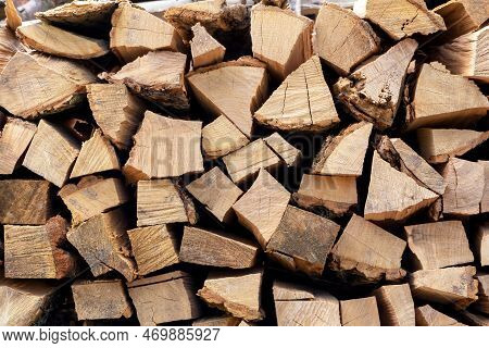 A Pile Of Dry Chopped Firewood. Preparing For The Winter. Harvesting Firewood. Natural Resources. He