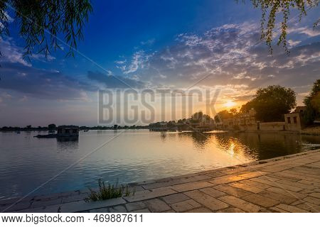 Beautiful Sunset At Gadisar Lake, Jaisalmer, Rajasthan, India. Setting Sun And Colorful Clouds In Th