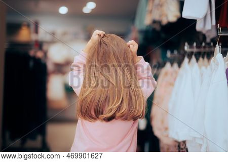 Desperate Little Girl Not Knowing What To Buy In A Store