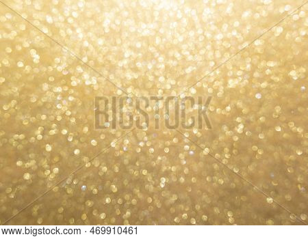 Christmas Golden Glowlight Glitter Blur Bokeh Abstract  Background.concept For Holiday Xmas And Happ