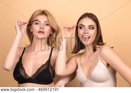 Two Women Shaping Brown Eyebrows. Woman Friends Eye With Beautiful Eyebrows. Shaped Brows, Long Eyel