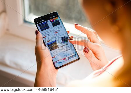 Kyiv, Ukraine - November 26, 2019: Woman Holding Phone With Internet Shopping Service Aliexpress On 